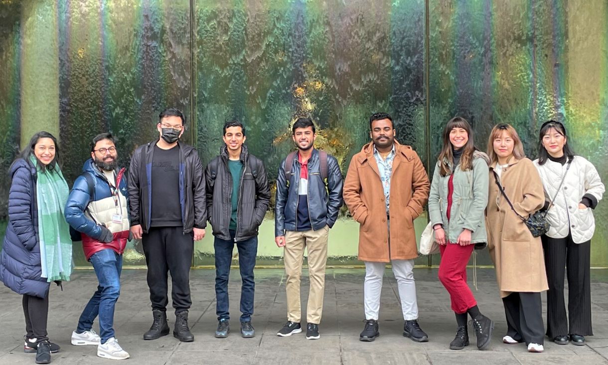 a group of international students smiling toward camera at the front of NGV Melbourne