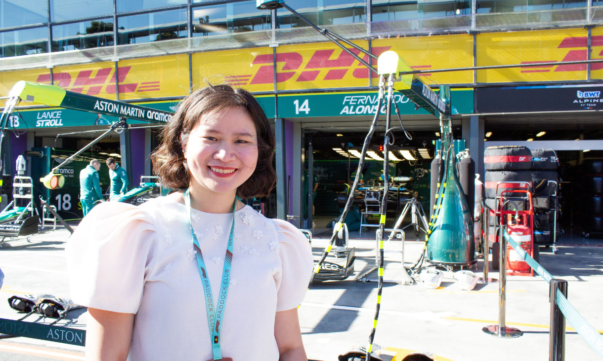 Faye poses in front of the Aston Martin pit stop area.