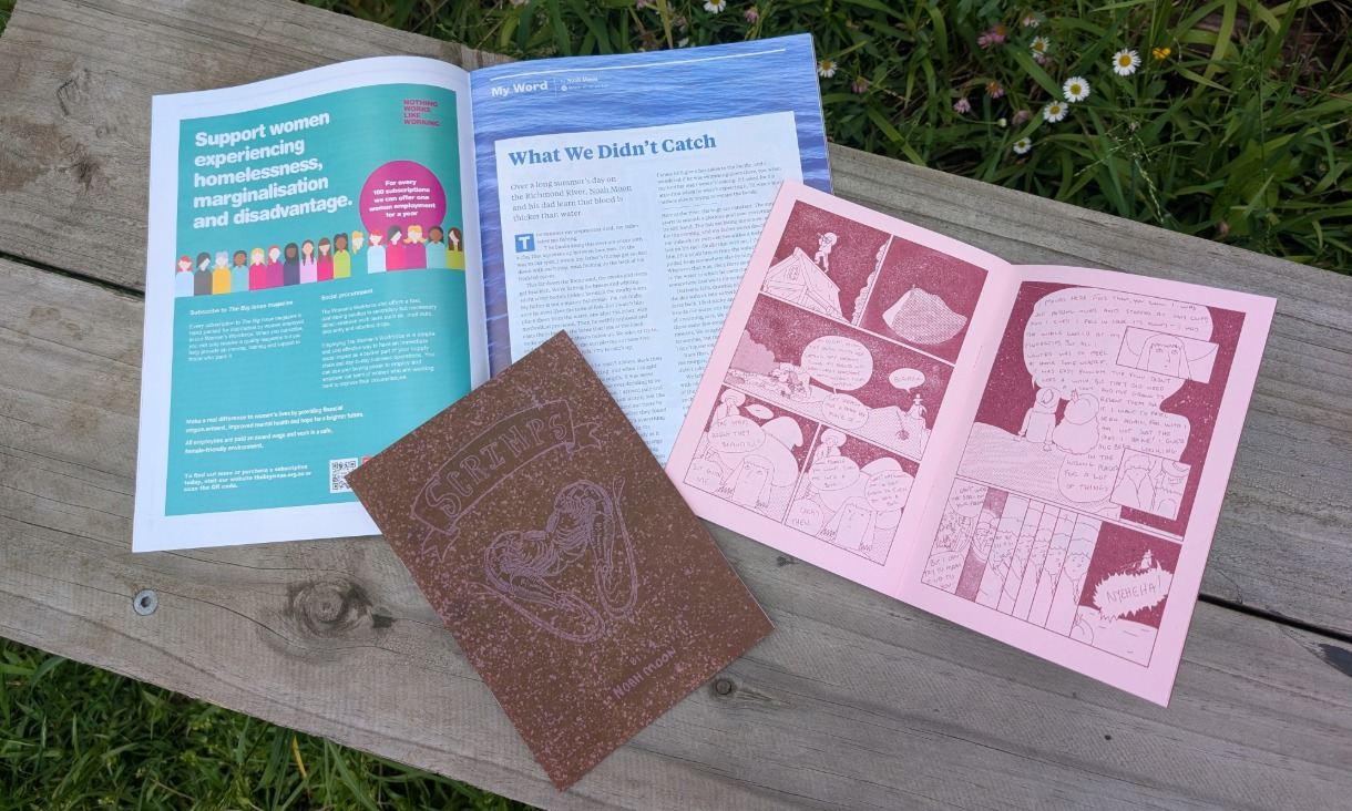 Magazines and comics on wooden bench outside