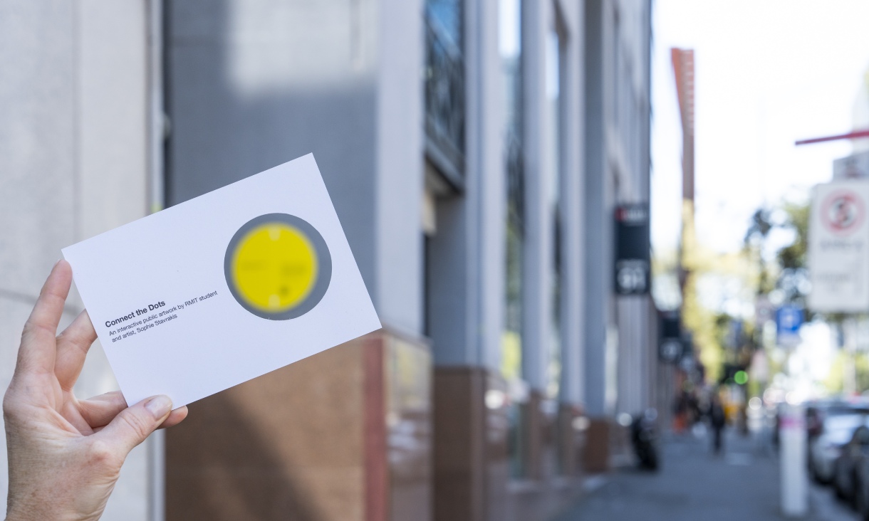 Postcards created for Sophie Sophie artwork, Connect the Dots, beiung held up outside Building 91.