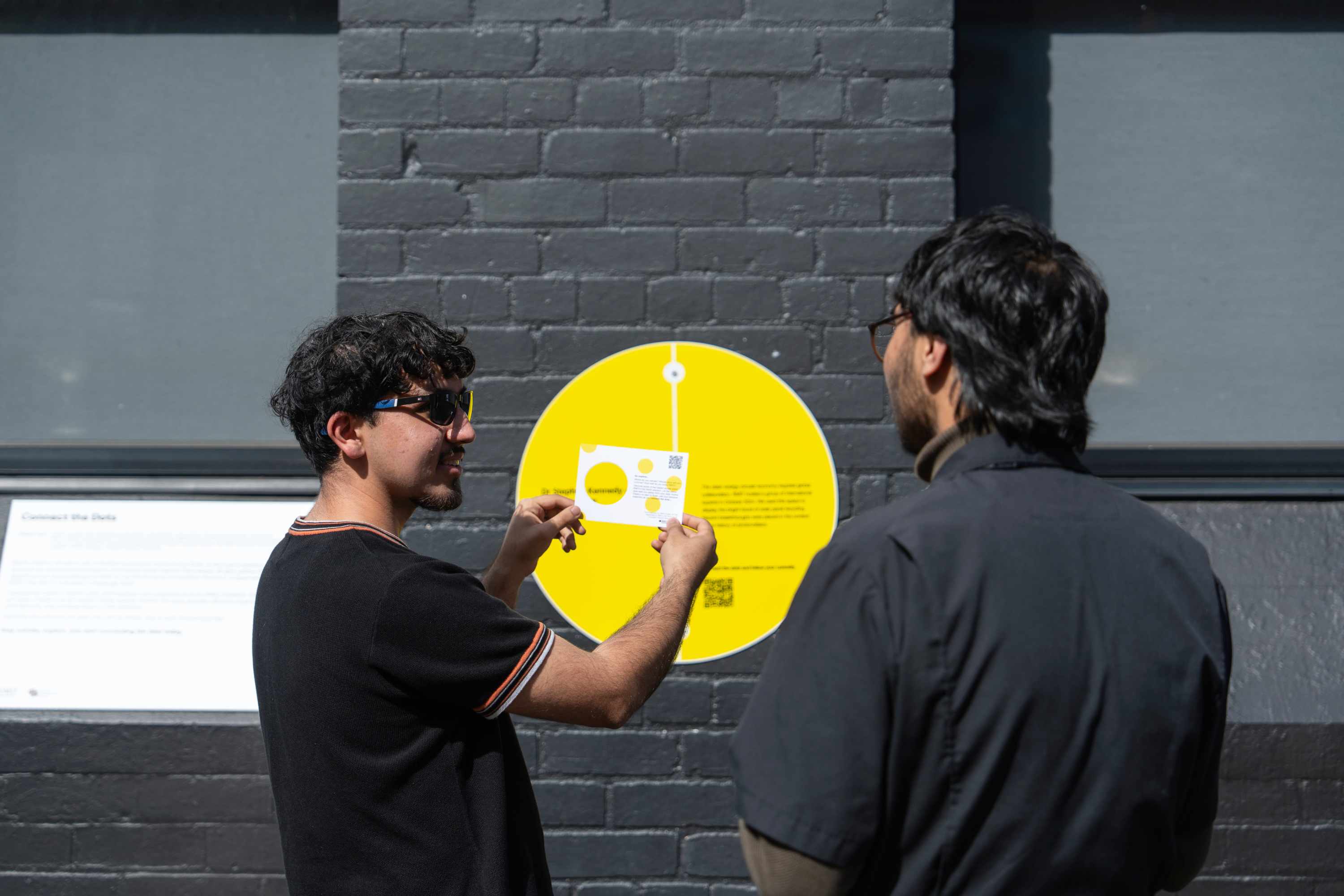 Poeple engage with Connect the Dots installation at RMIT Melbourne city campus