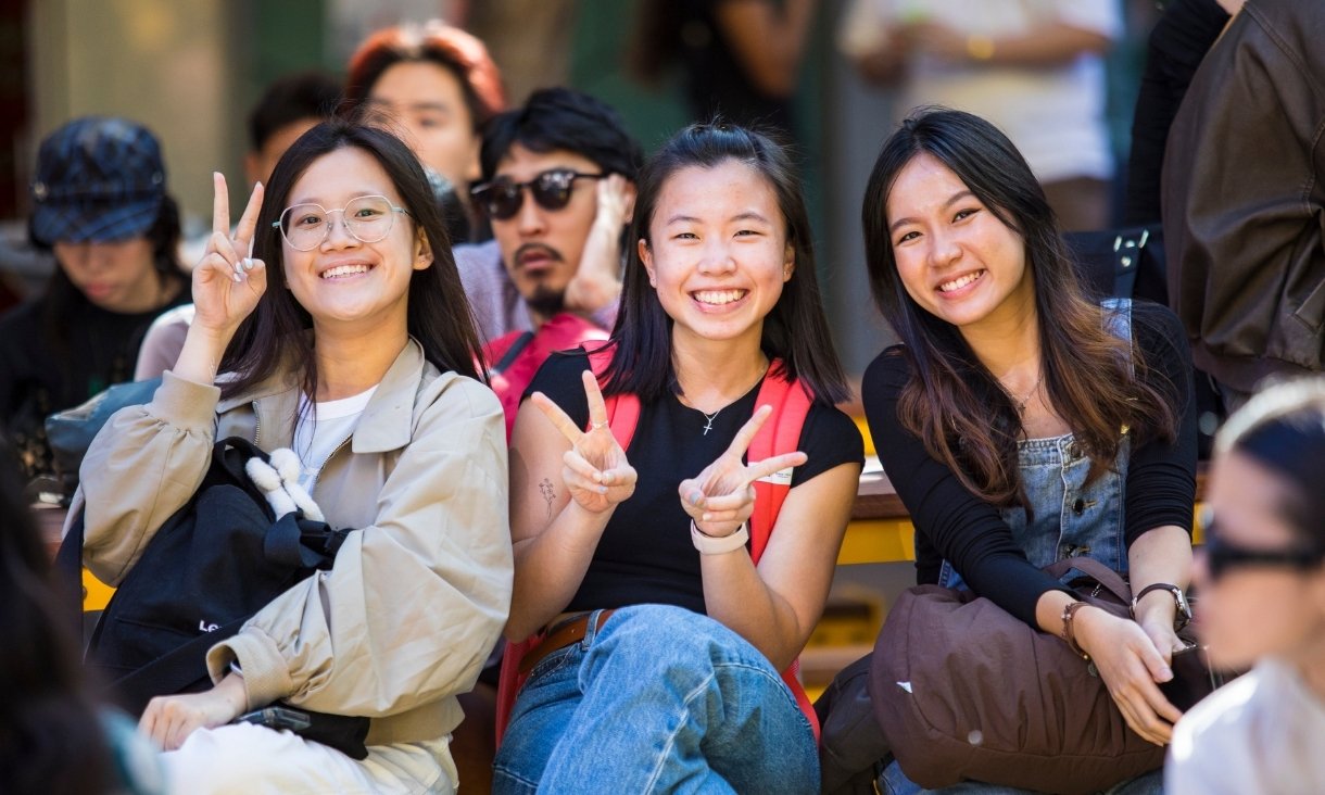 Three people smiling at camera