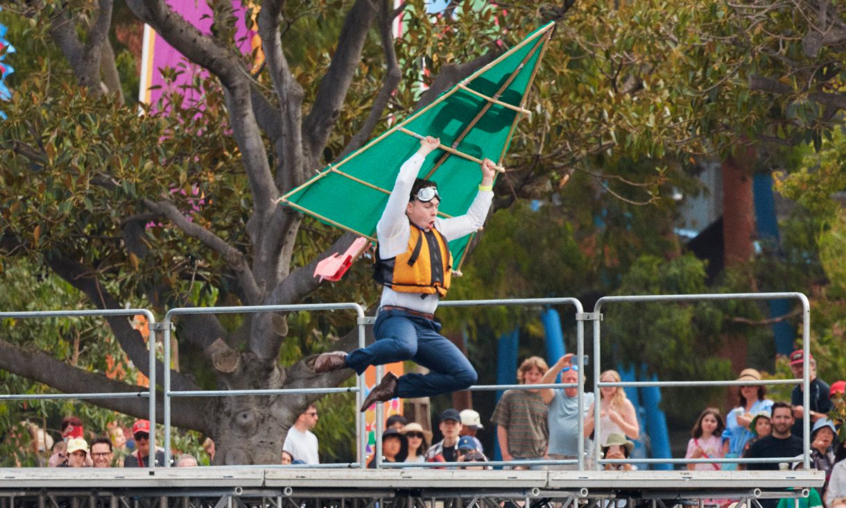 Person holding aircraft jumping