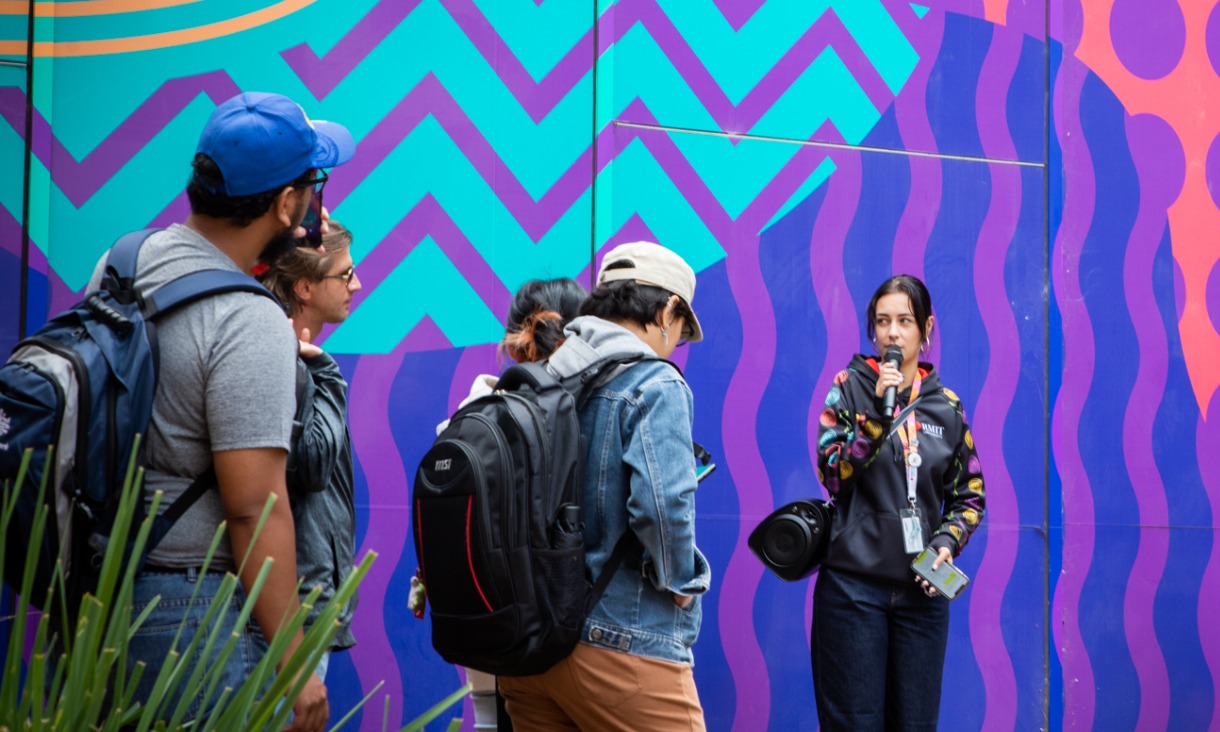 Five people standing outdoors