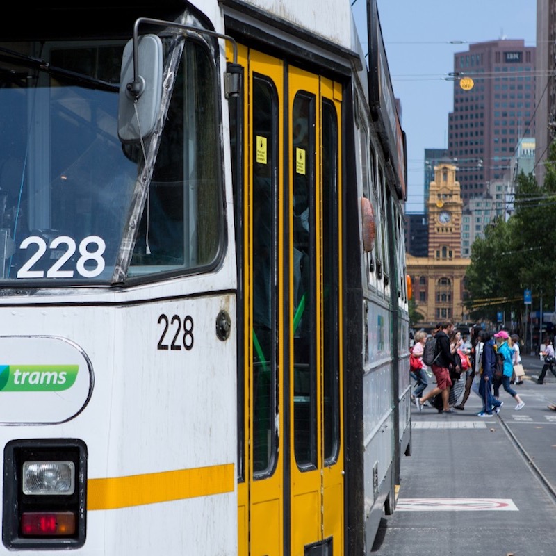 A Melbourne tram travels near Flinders Street Station.