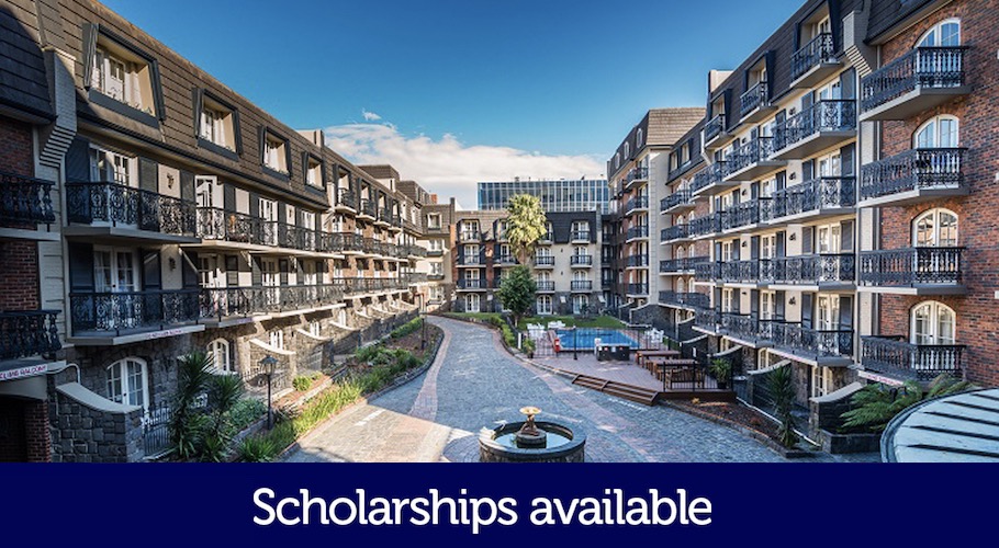 An expansive stone courtyard with many balconies is pictured. The words 'Scholarships available' are printed on the photo.