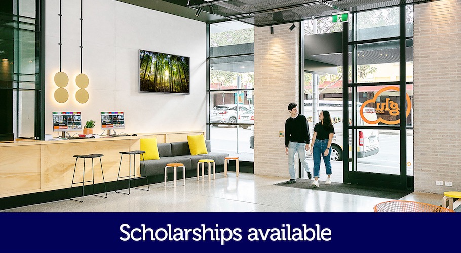 Two students walk through a lobby. The words 'Scholarships available' is printed on the photo.