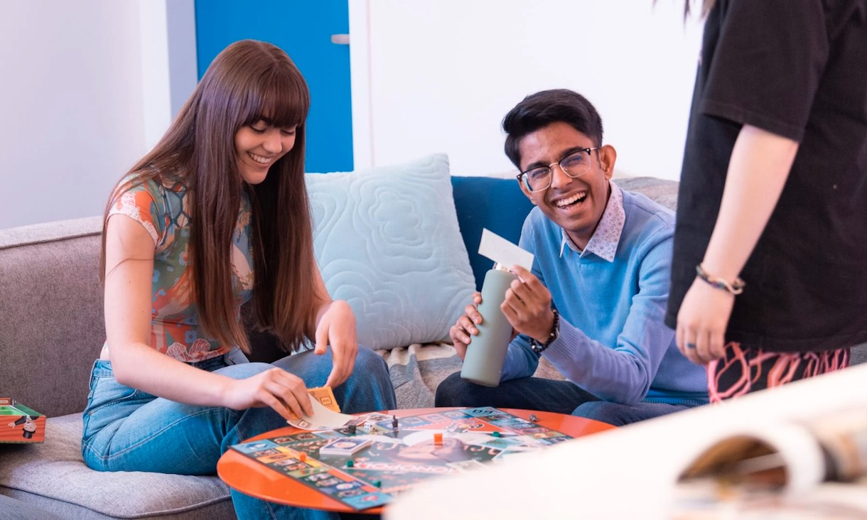 Students playing a board game.