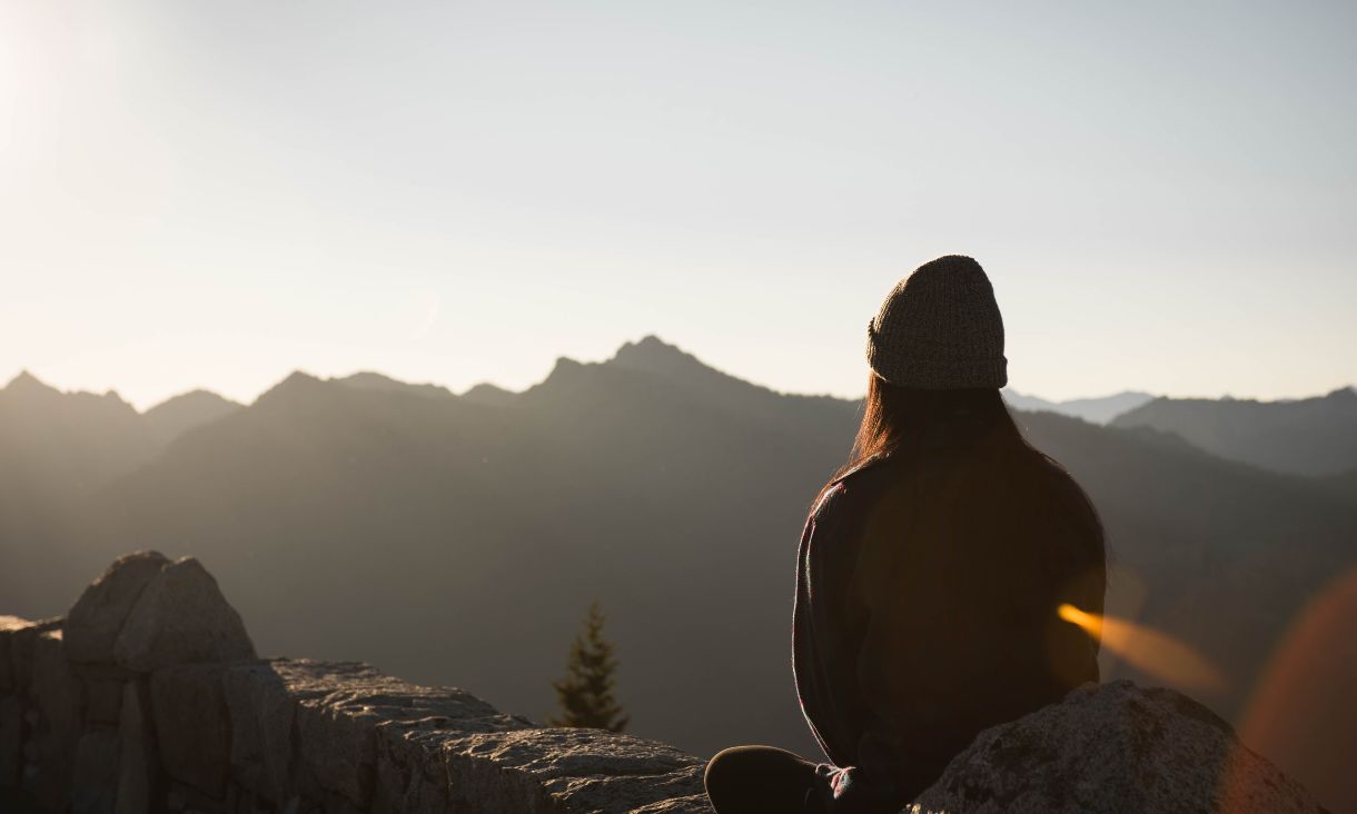 A girl sits and meditates.