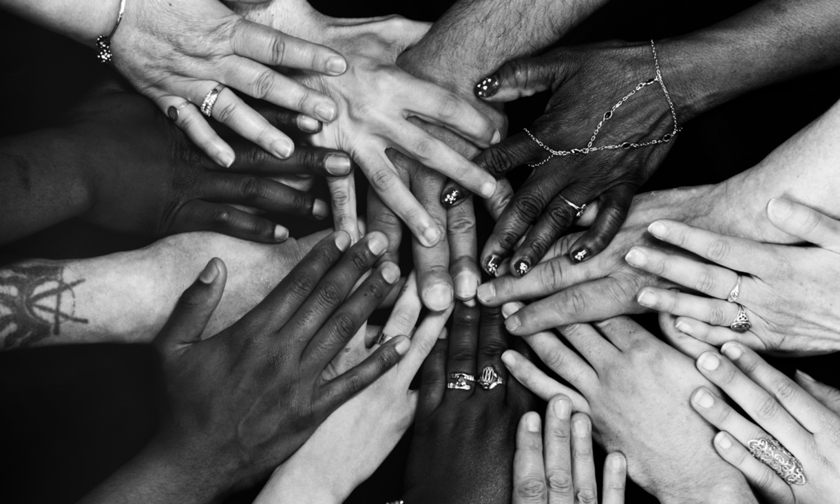 A group of diverse hands joined together