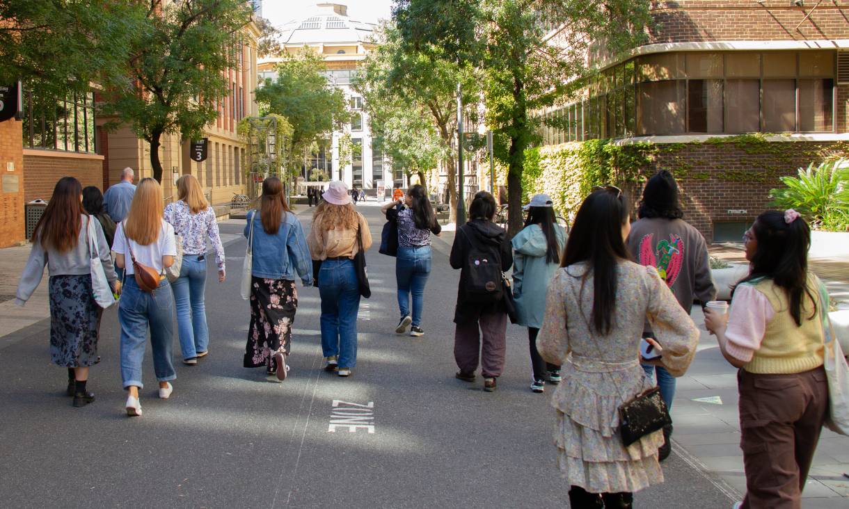A group of students walking around RMIT Melbourne City Campus
