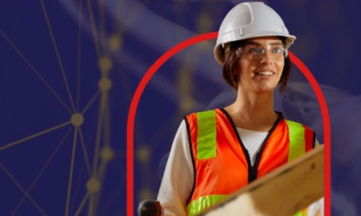Woman wearing hard hat against navy background