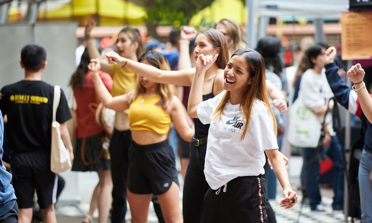 RMIT students dance at an event.