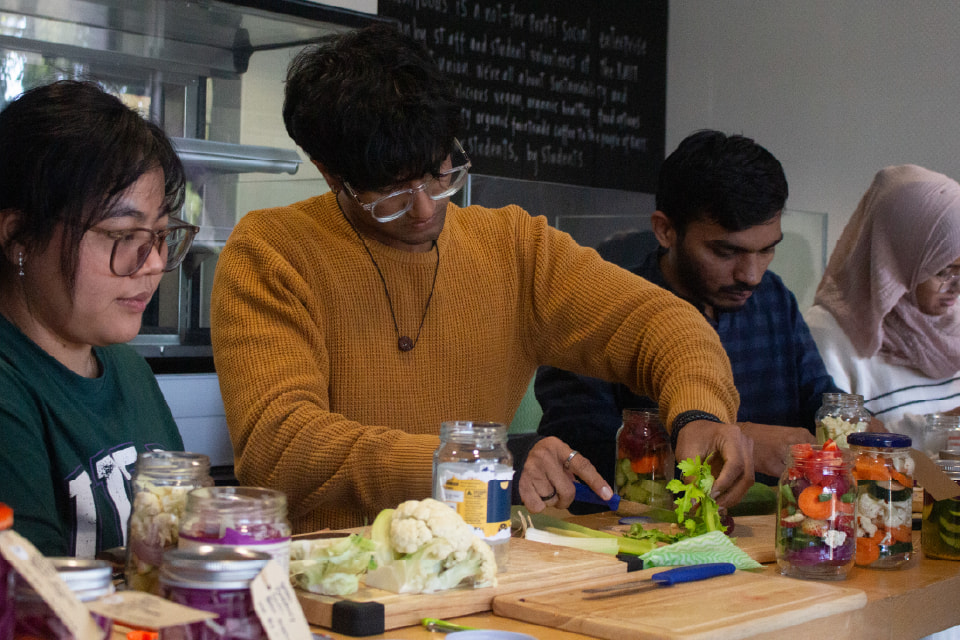 A group of students cooking together