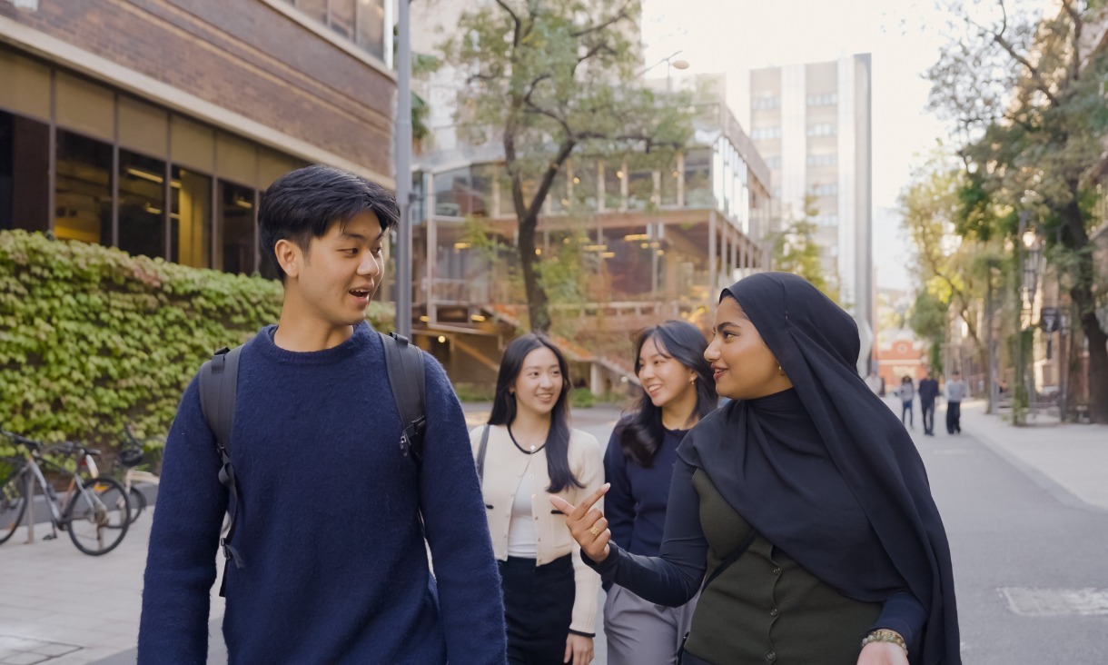 Four students talking together at the RMIT Melbourne City campus