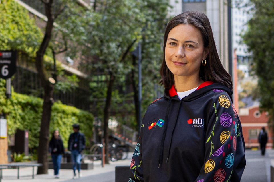 Aboriginal woman of Pitjantjatjara descent Lucinda Johnson-Cornes is photographed on Bowen Street (southern entrance at La Trobe Street) – the main thoroughfare of Melbourne City campus.