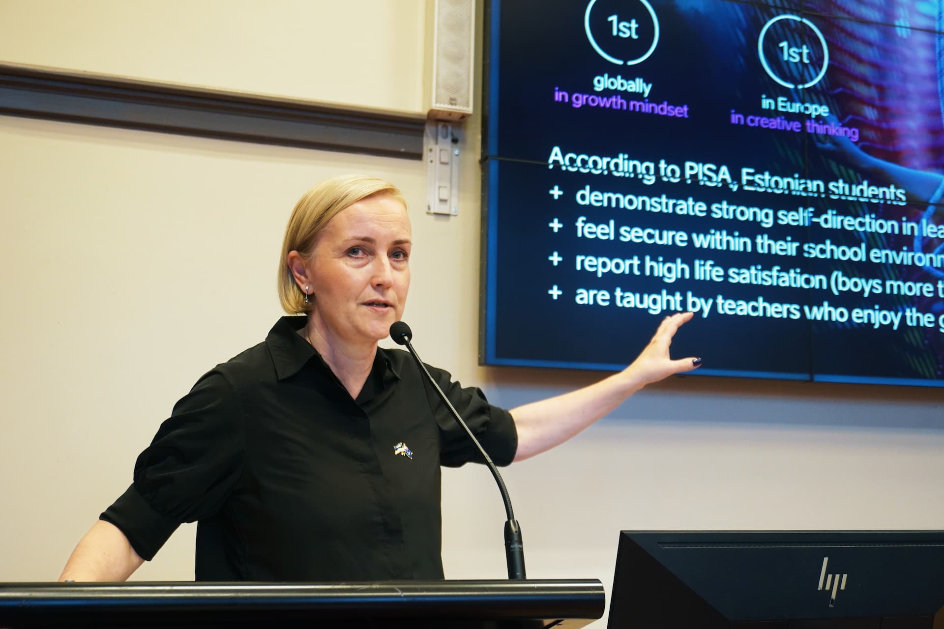 Person giving presentation from lecturn