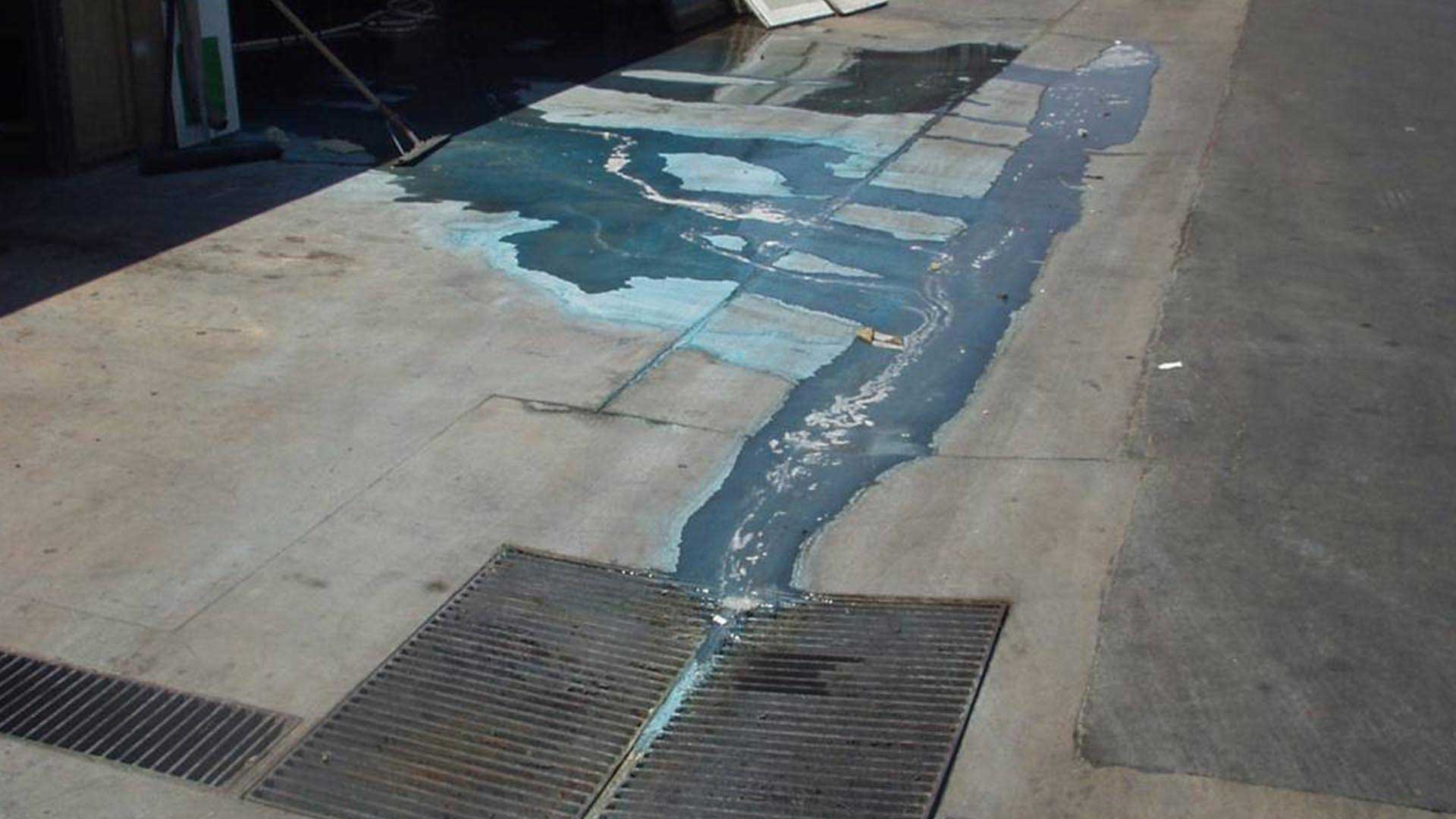 chemical waste flowing into drain