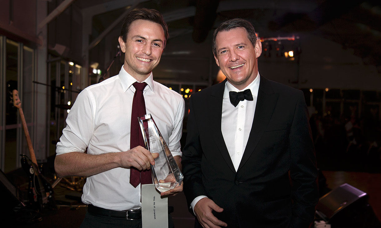 James Oaten poses with his Journalist of the Year award and NT Chief Minister Michael Gunner.
