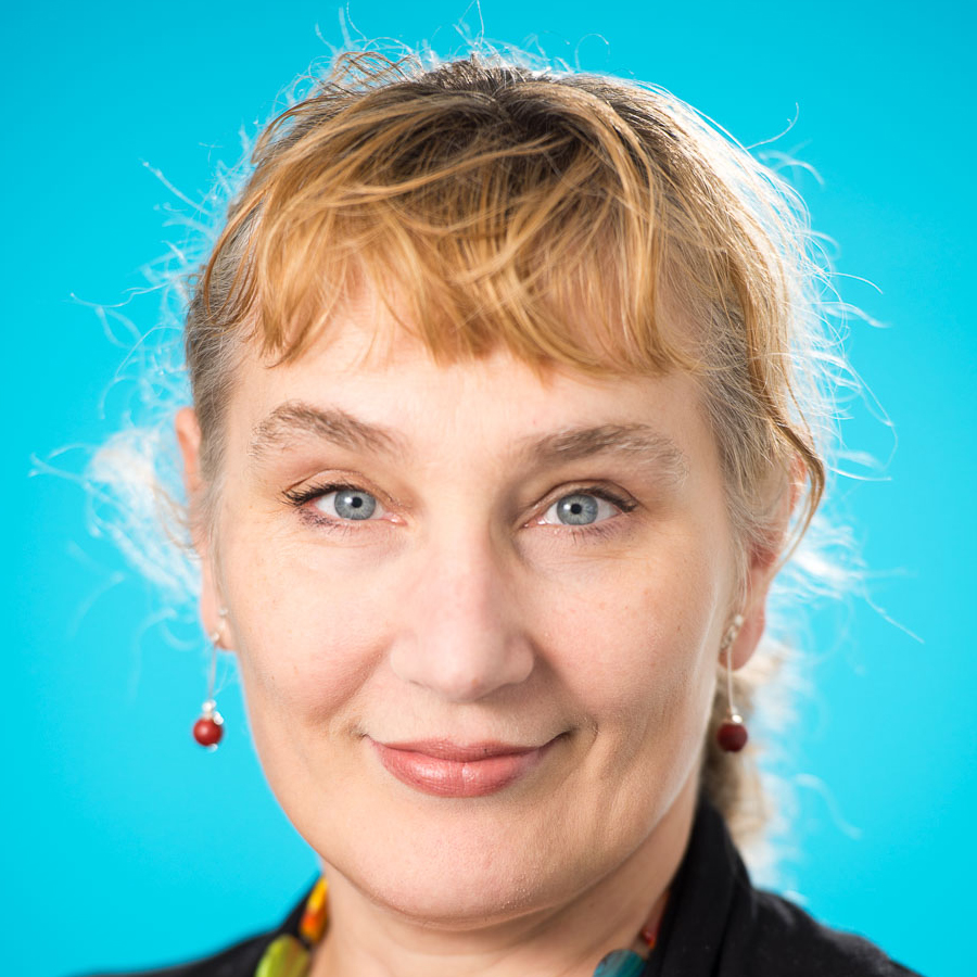 Profile photo of Magdalena Plebanski smiling towards the camera against a blue background