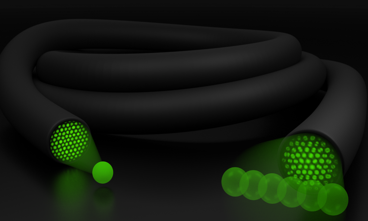 An illustrated image showing a fibre bundle and green light.