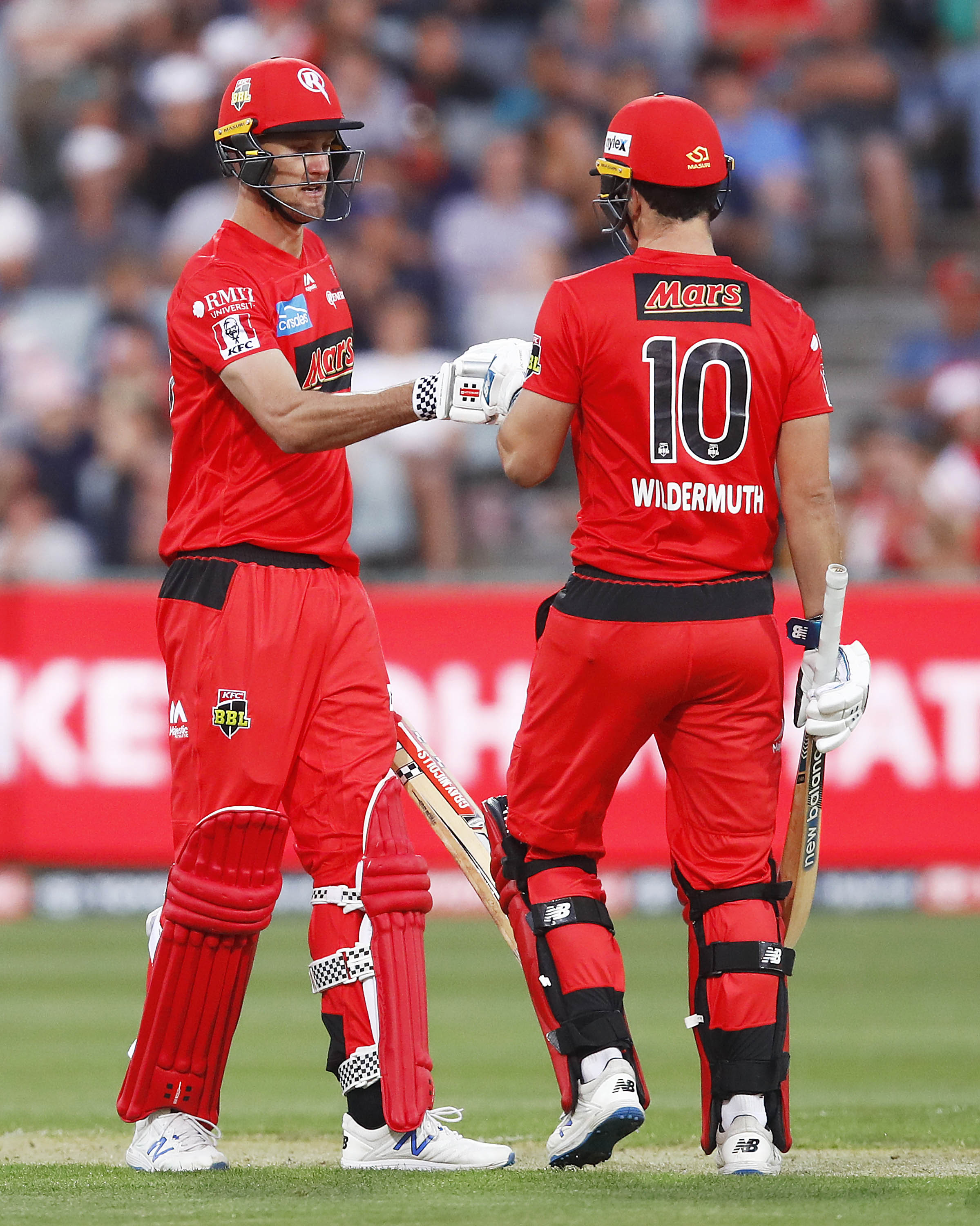 MELBOURNE, AUSTRALIA - DECEMBER 19: Beau Webster of the Renegades (L) and Jack Wildermuth of the Renegades high five during the Big Bash League match between the Melbourne Renegades and the Sydney Thunder at GMHBA Stadium on December 19, 2019 in Melbourne, Australia. (Photo by Daniel Pockett/Getty Images)