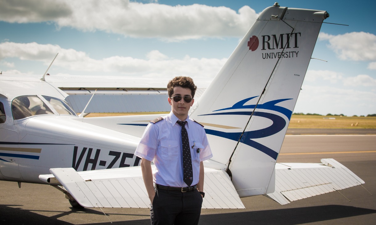 Flight student in front of plane
