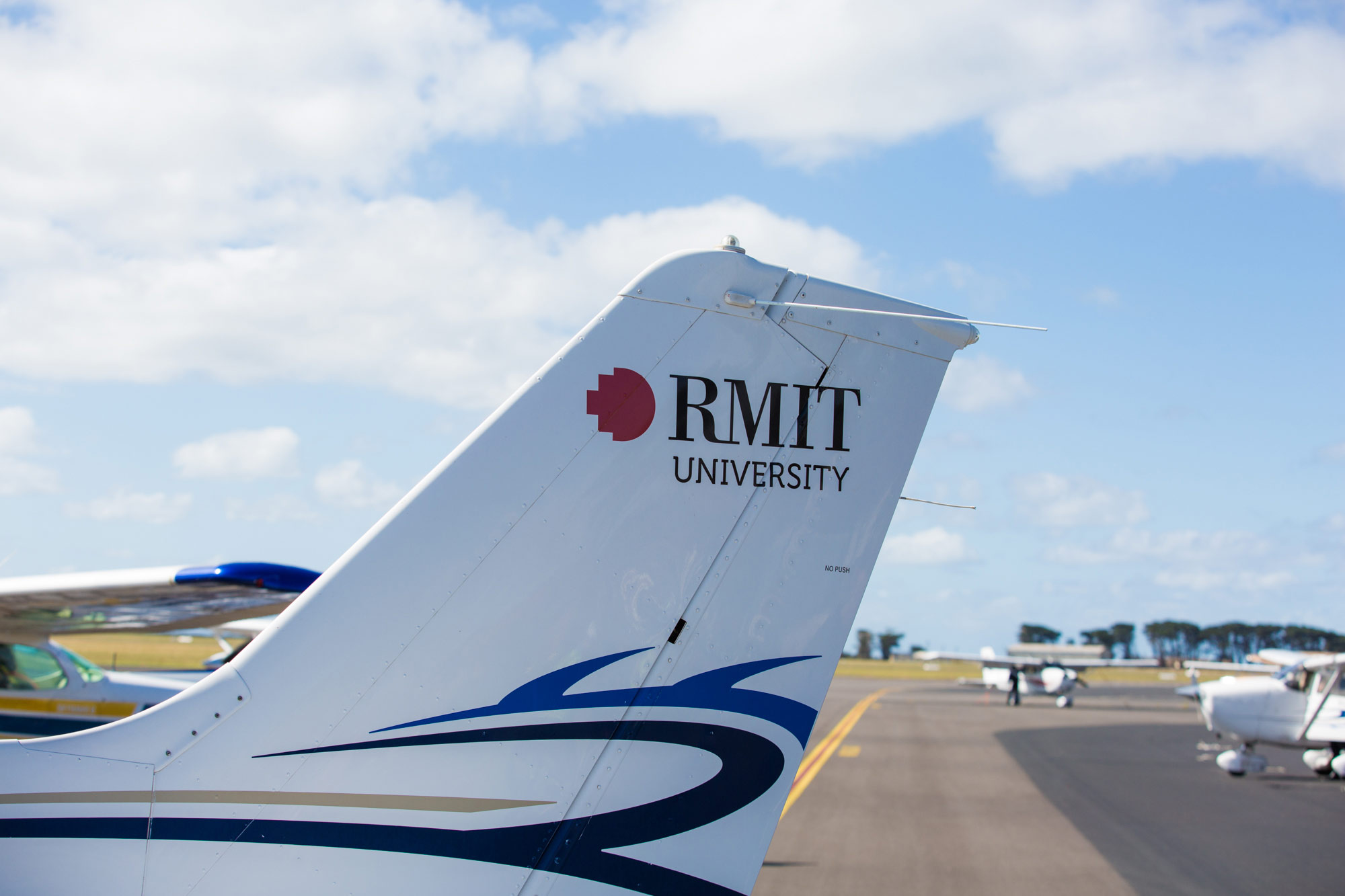 RMIT logo on the tail of an aeroplane