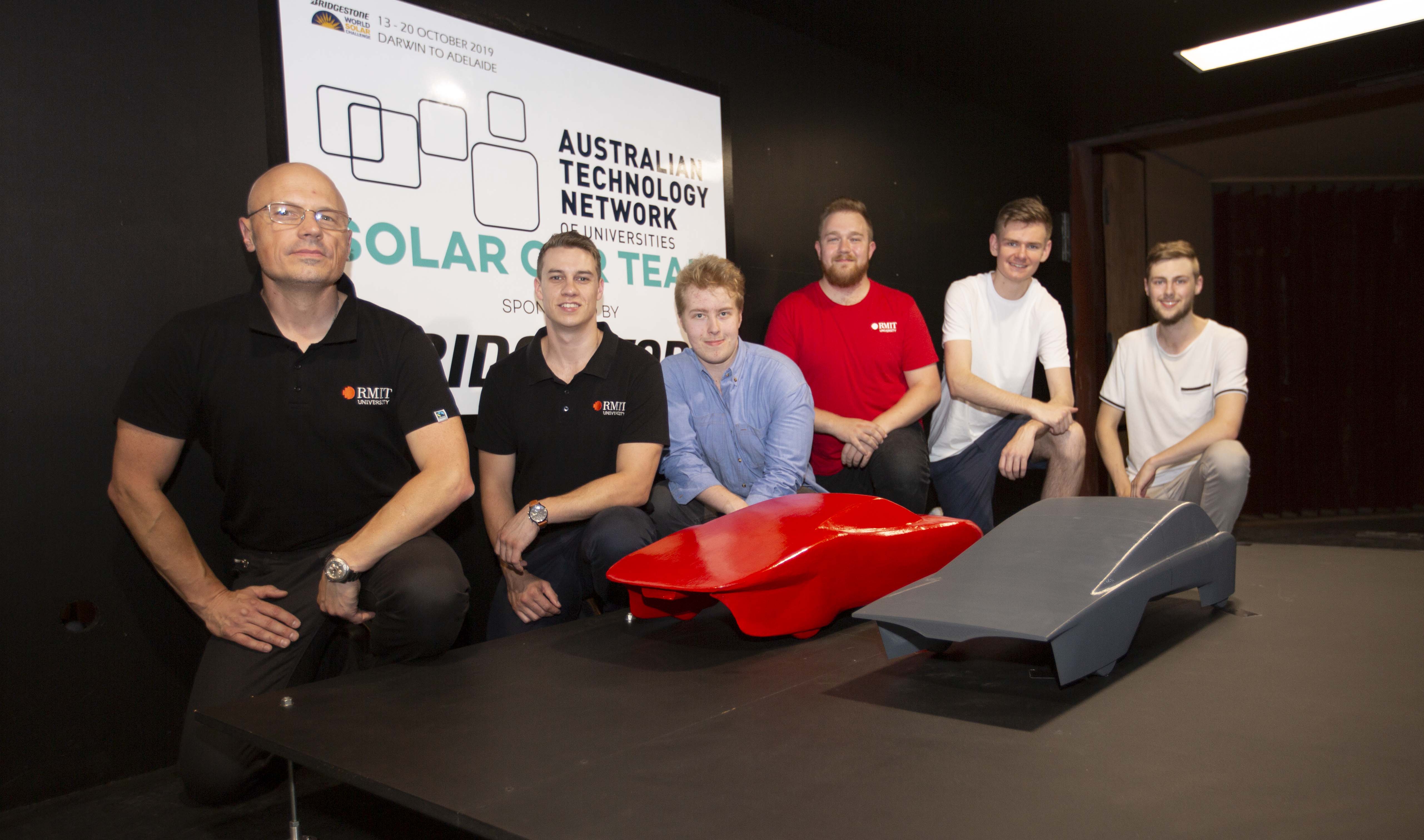 Preparing for the challenge: the ATN solar car team in the RMIT industrial wind tunnel.