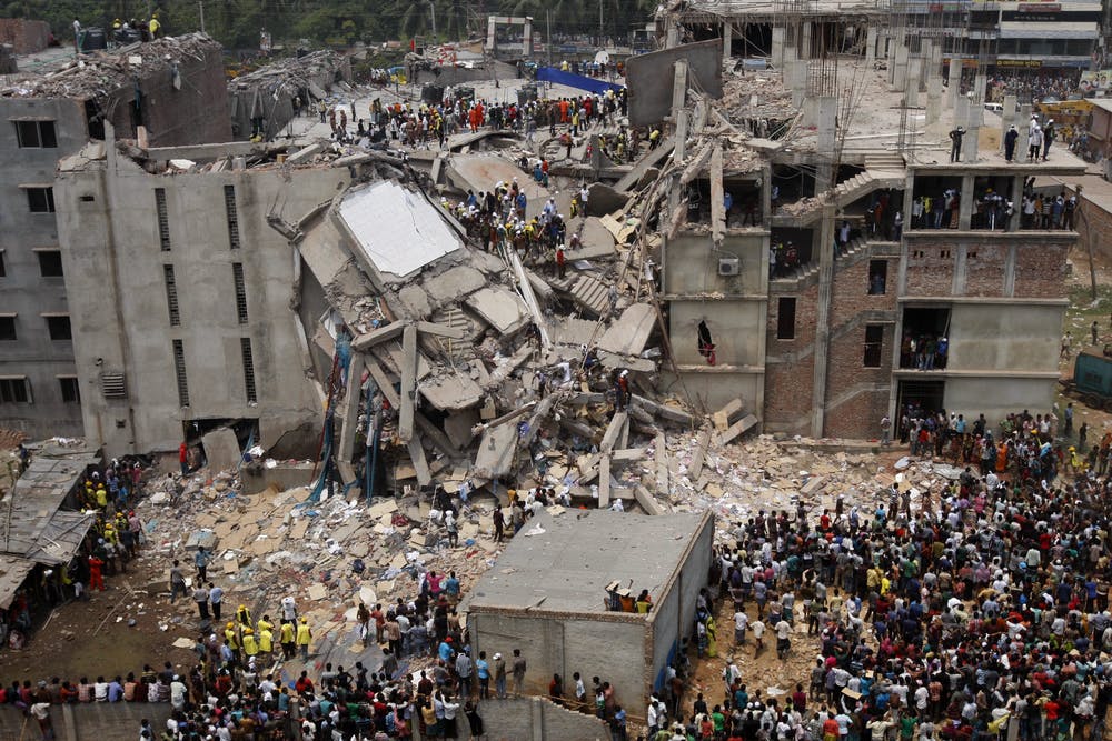 Rescue workers search for survivors in the ruins of the collapsed Rana Plaza building on April 25 2013. Abir Abdullah/EPA