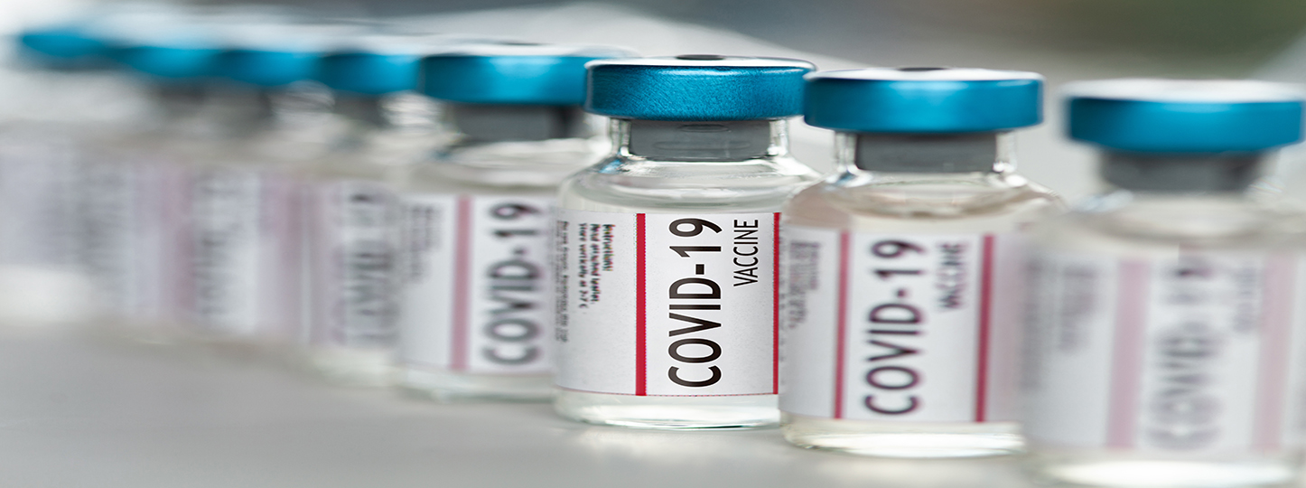 Covid-19 Coronavirus Vaccine vials in a row macro close