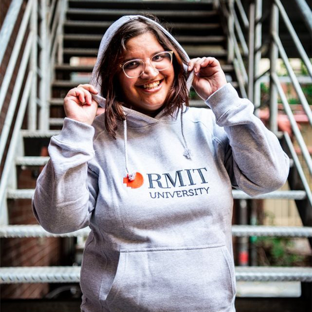 Alt Text is not present for this image, Taking dc:title 'Michelle Gissara embraced student life at RMIT, including modelling jumpers for the campus store.'