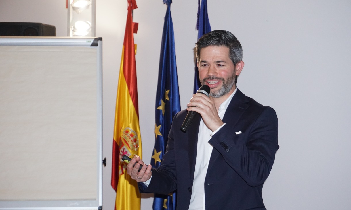 Juan Cortés speaking at an event