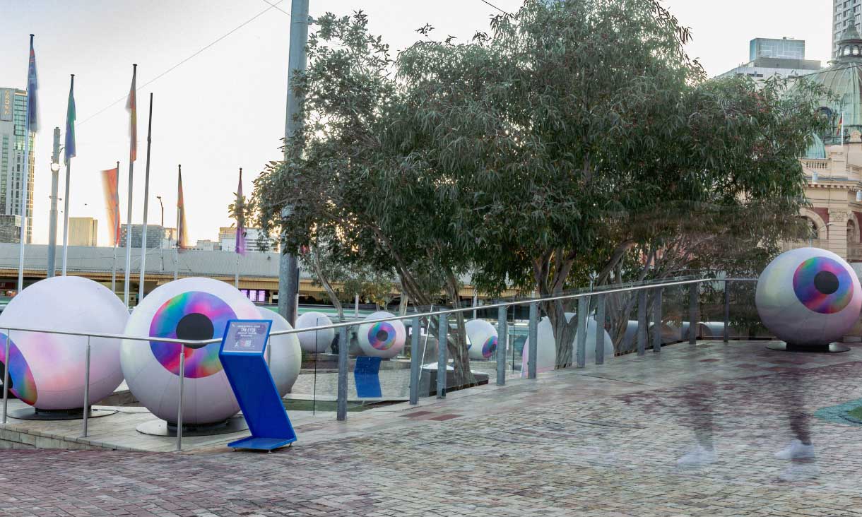 An art installation of giant eyeballs on the ground at Federation Square called The Eyes