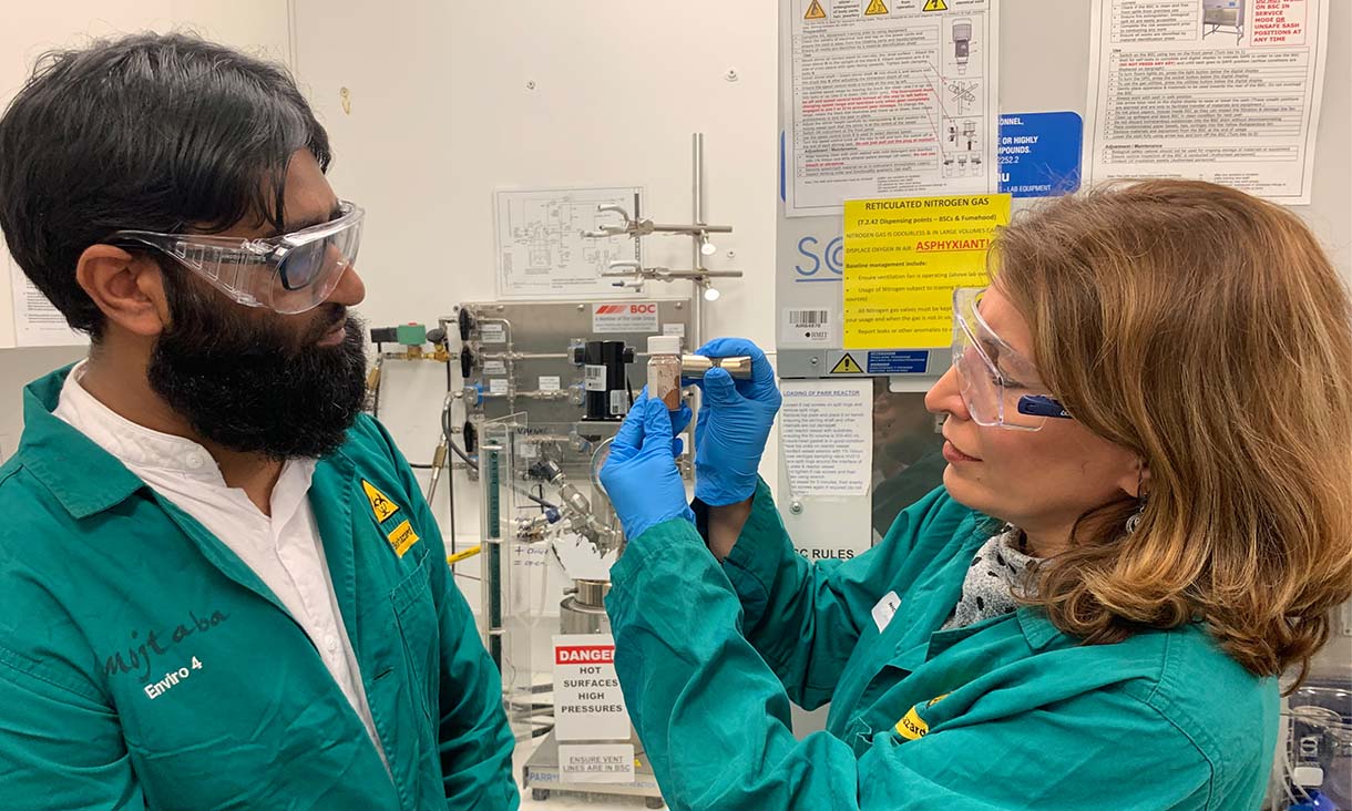 PhD candidate Muhammad Haris and Professor Nicky Eshtiaghi (left to right) with the magnetic material that they developed into adsorbents that remove microplastics and dissolved pollutants from water. Credit: RMIT University