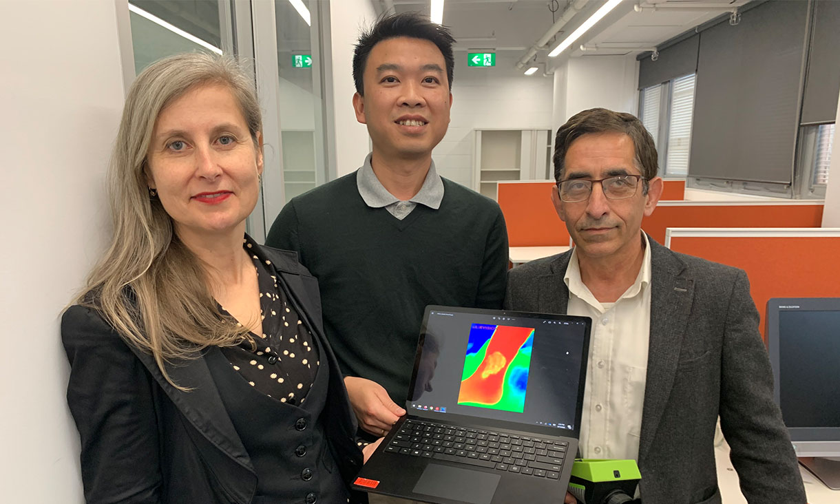 Dr Rajna Ogrin, Dr Quoc Cuong Ngo and Professor Dinesh Kumar (left to right) holding a standard thermal imaging device, similar to what was used as part of the research. Credit: RMIT University