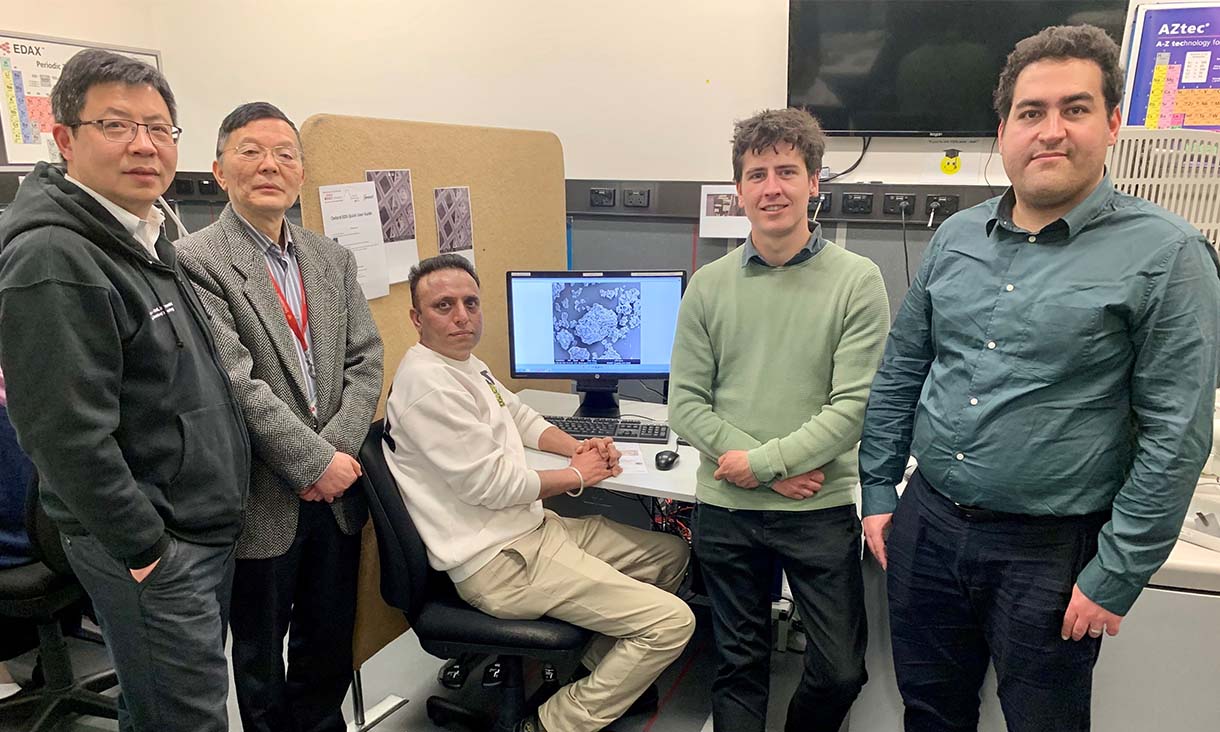 RMIT researchers Professor Kevin Zhang, Professor Jie Li, Dr Rajeev Roychand, Dr Shannon Kilmartin-Lynch and Dr Mohammad Saberian in the RMIT Microscopy and Microanalysis Facility, where they analysed the structure of their coffee concrete (pictured left to right). Credit: Will Wright, RMIT University