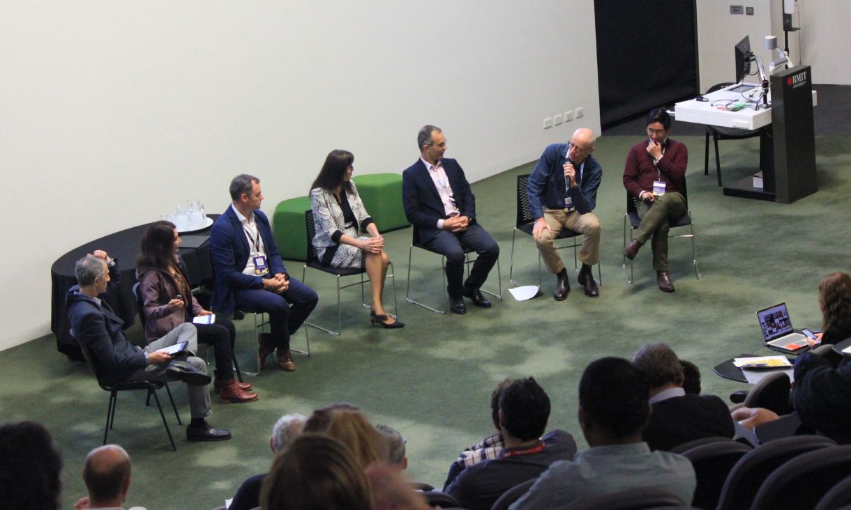 Panel of seven experts engaged in discussion