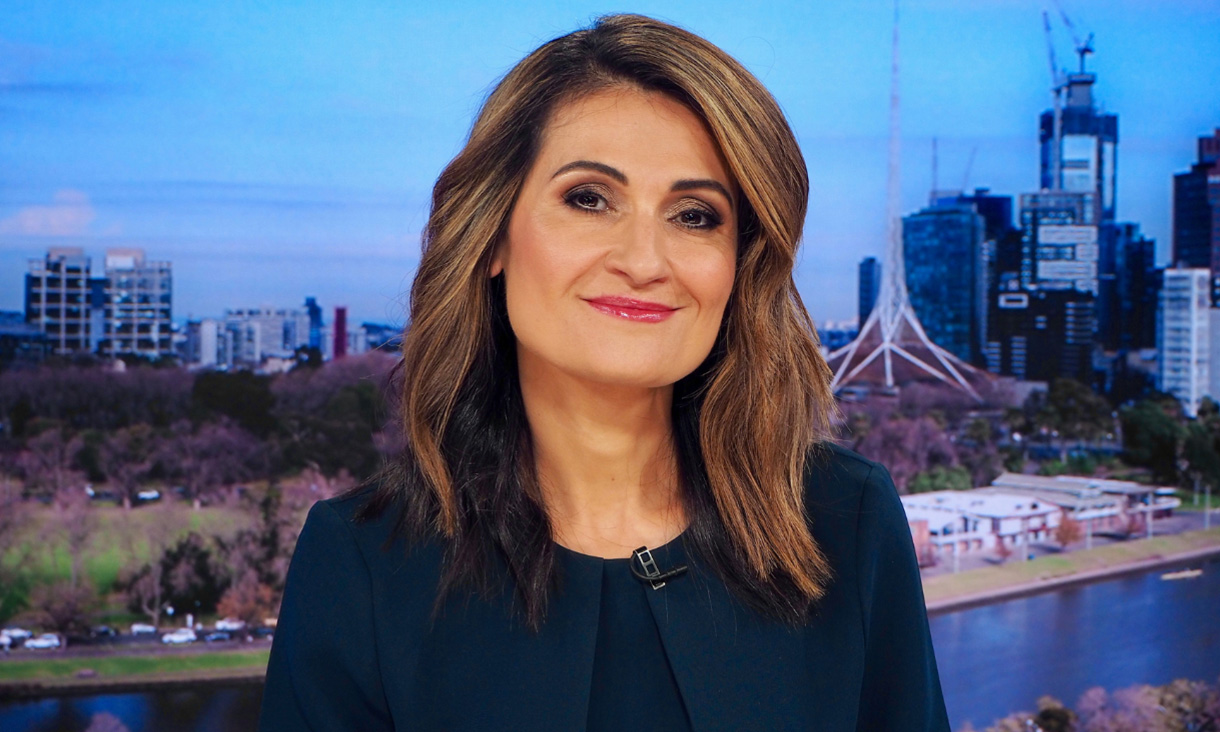 Patricia Karvelas smiles at the camera in a headshot. She wears a black top and jacket