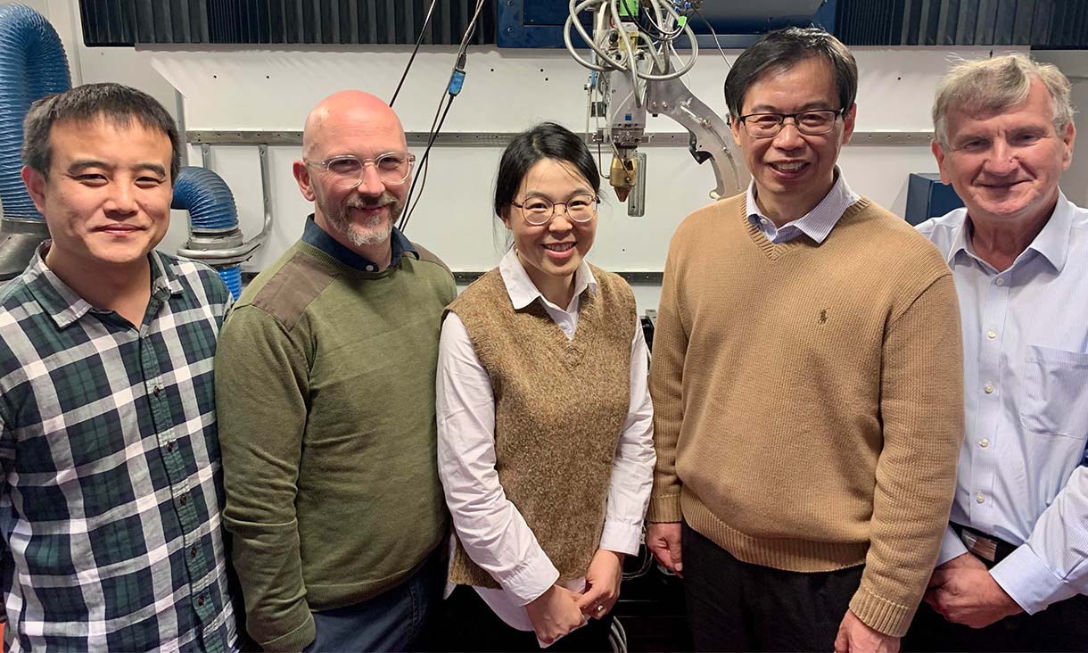 Team members Shenglu Lu, Alan Jones, Tingting Song, Ma Qian and Milan Brandt (left to right) in front of the laser 3D printer that the team used at RMIT University. Credit: RMIT
