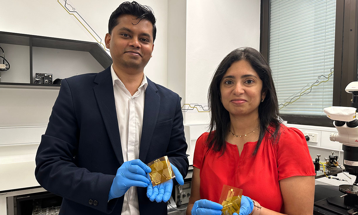 Inventors PhD scholar Peter Elango and Professor Madhu Bhaskaran holding the dry electrodes, which are part of the RMIT ECG device. Credit: Seamus Daniel, RMIT University
