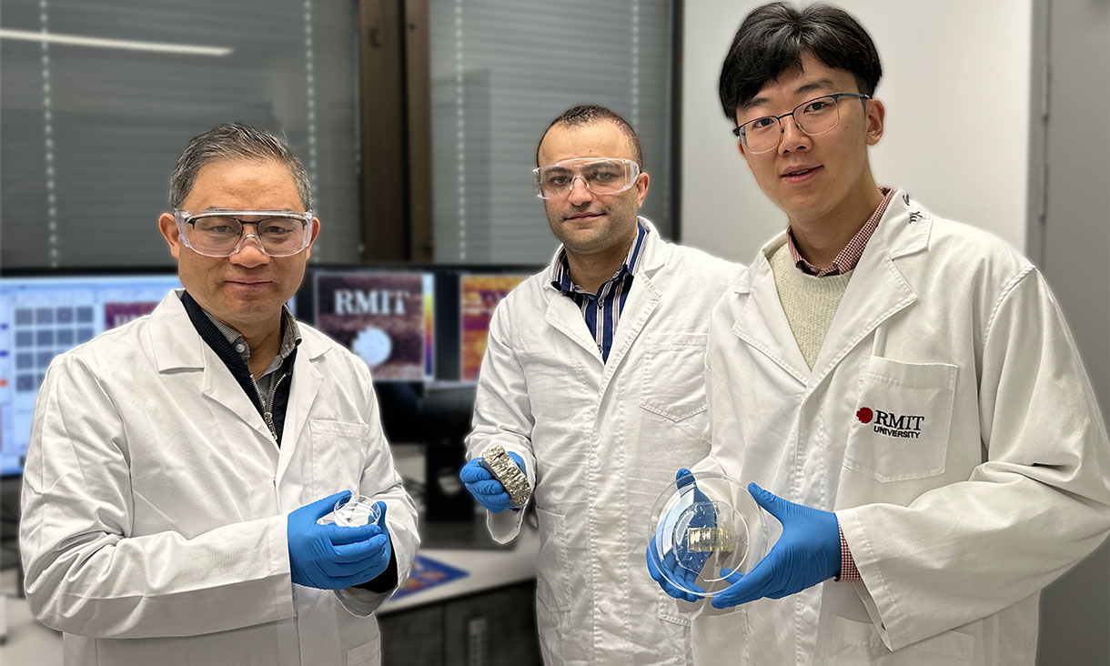 Professor Yongxiang Li, Dr Ali Zavabeti with bismuth metal and PhD scholar Xiangyang Guo holding the wearable device in a petri dish (left to right) in their lab at RMIT University. Credit: Seamus Daniel, RMIT University