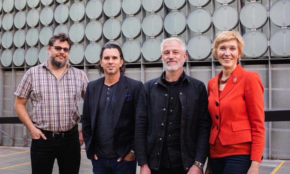 Allister Hill, Simon Lockrey, Liam Fennessy and Helen Millicer outside the RMIT Design Hub building.