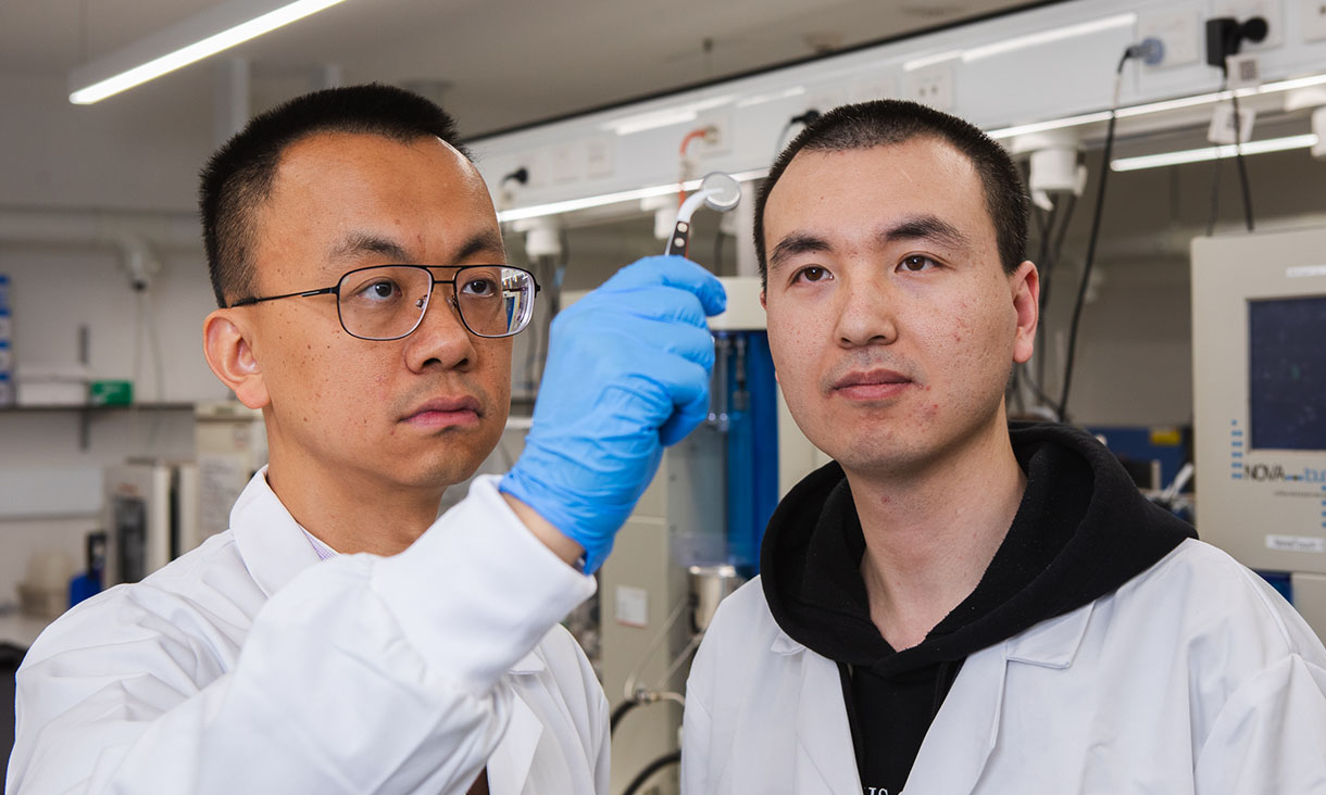Distinguished Professor Tianyi Ma (left) and Dr Lingfeng Zhu at RMIT University with the team’s water battery. Credit: Carelle Mulawa-Richards, RMIT University