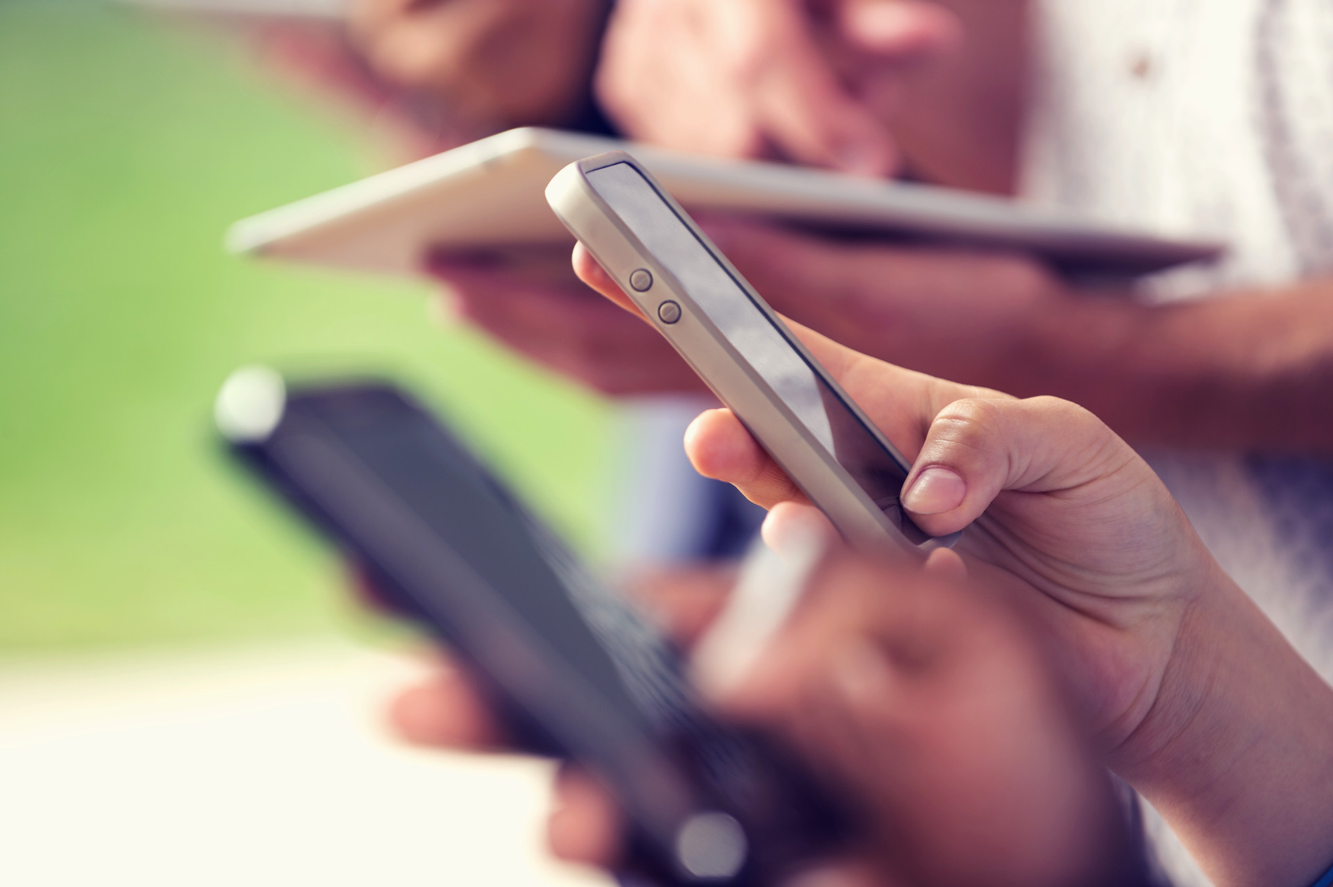 group of people holding phones