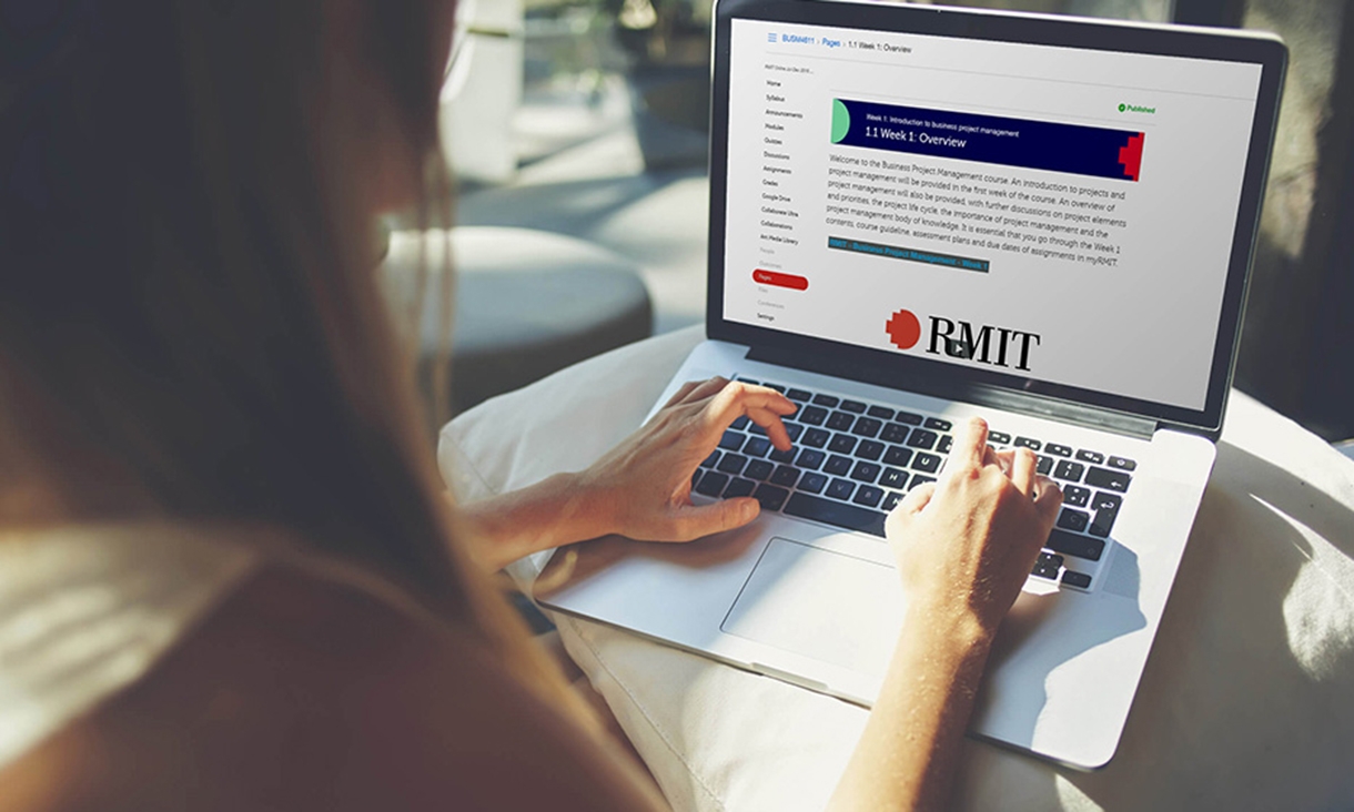 Female browsing RMIT online on laptop